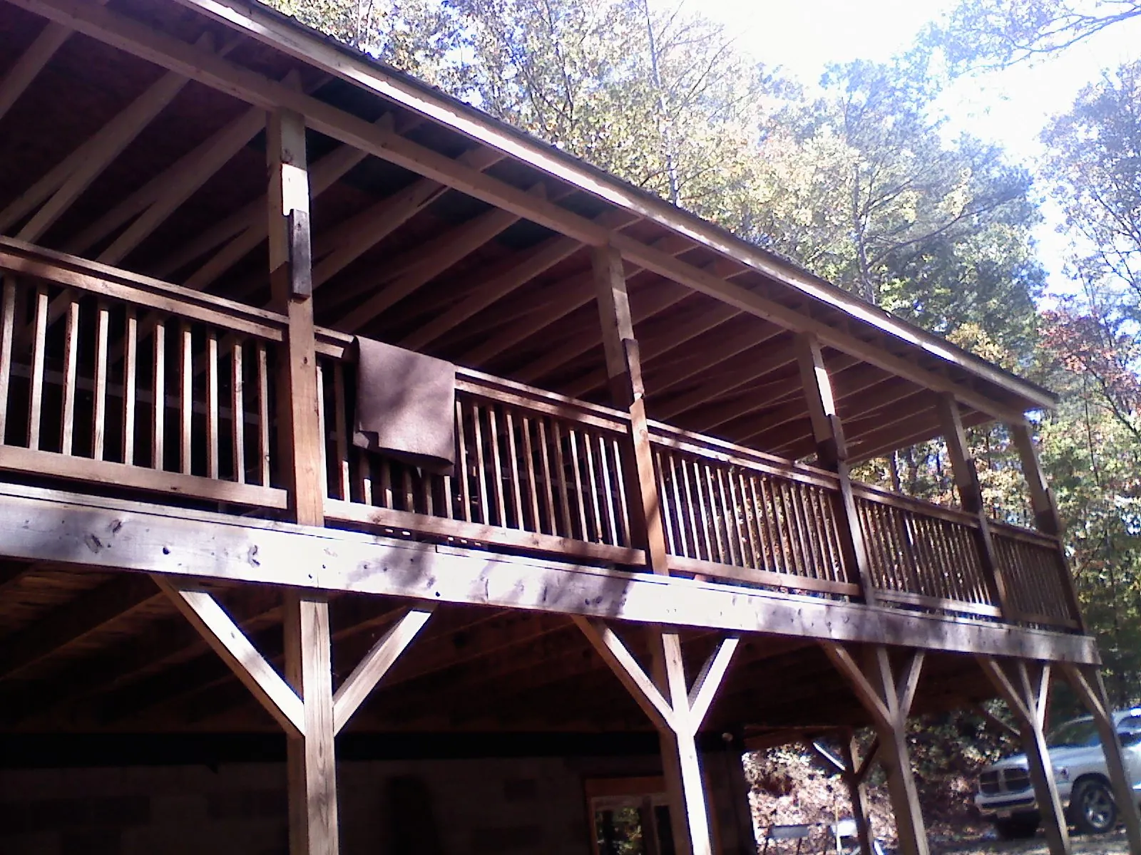 Timber framing under a new elevated porch and deck — Roof Leak Repair in Gilmanton Iron Works by Roofing Brothers